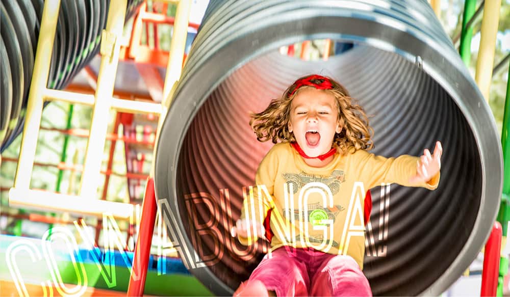 child enjoying the slide at brooklyn green meadows farm ny